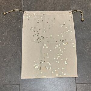 Free People Gold Star Gift Bag with accent 🔔 bells on drawstring